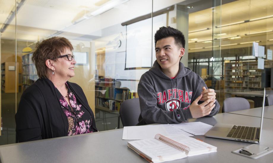 An international student meets with faculty member Jean Preston.