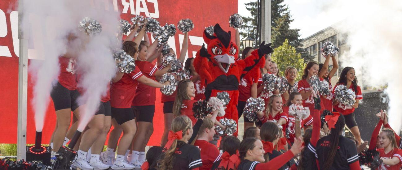 The Carthage College spirit team reveals Ember, the new Firebirds mascot, during 首页。coming Weeke...